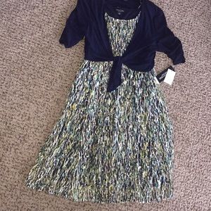 Sleeveless dress with solid blue jacket